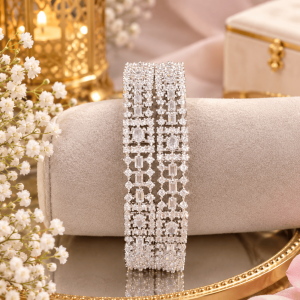 ornate silver bangles on velvet